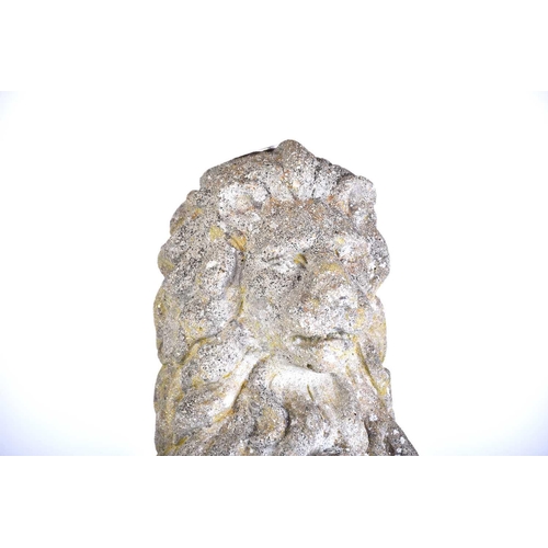 343 - A pair of cast stone figures of standing heraldic lions each holding a shield with 