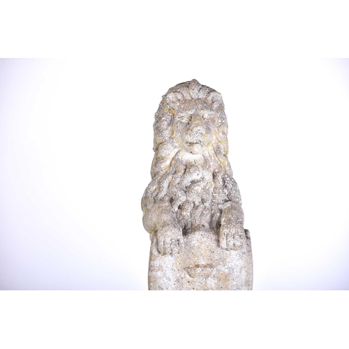 343 - A pair of cast stone figures of standing heraldic lions each holding a shield with 