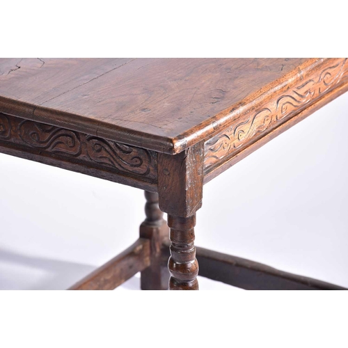 344 - An early 18th-century oak oval gateleg table with single frieze drawer and turned Doric column spind... 