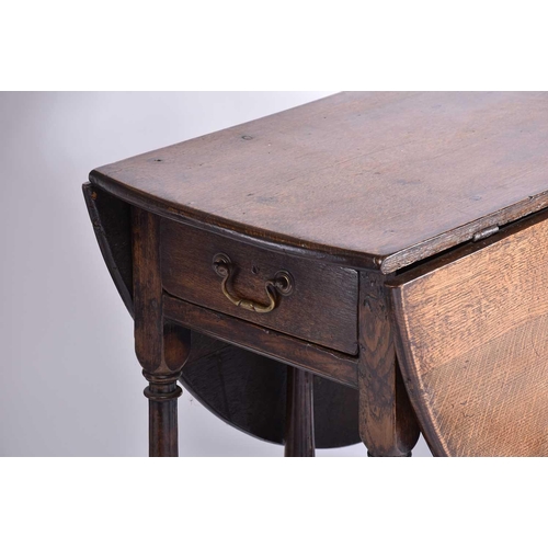 344 - An early 18th-century oak oval gateleg table with single frieze drawer and turned Doric column spind... 