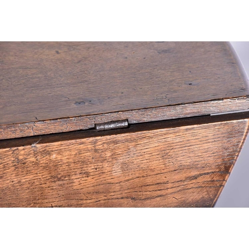 344 - An early 18th-century oak oval gateleg table with single frieze drawer and turned Doric column spind... 