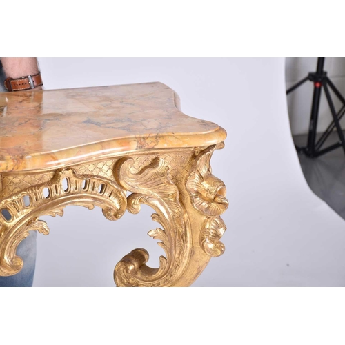 346 - An 18th-century marble topped carved wood and gilt gesso console table with shaped cabriole supports... 