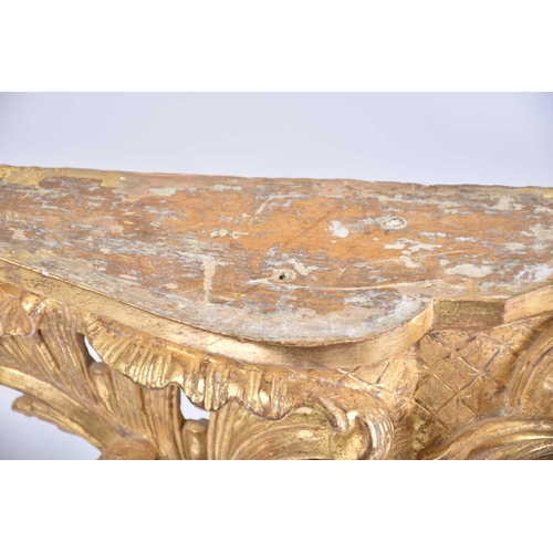 346 - An 18th-century marble topped carved wood and gilt gesso console table with shaped cabriole supports... 