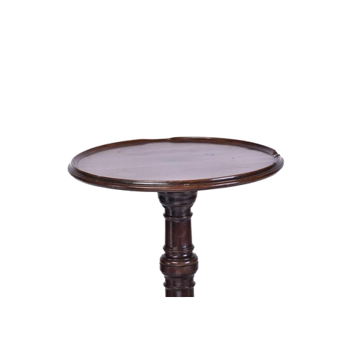 348 - A Regency dish topped circular mahogany wine table with an urn column and inverted sure supports ter... 