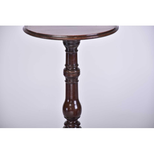 348 - A Regency dish topped circular mahogany wine table with an urn column and inverted sure supports ter... 