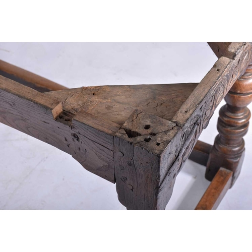 349 - A 17th century oak refectory table with clamped plank top on a box frame base with slender cup and c... 