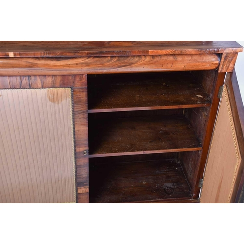 354 - A Regency goncalo alves chiffonier, with a two shelf superstructure above a base with a pair of plai... 