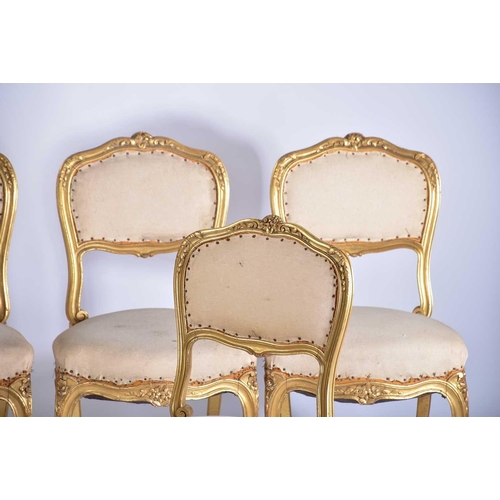 355 - † A set of six Louis XV style carved wood and gilt gesso salon chairs, early 20th century, with flor... 