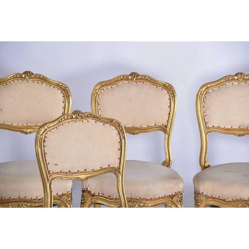 355 - † A set of six Louis XV style carved wood and gilt gesso salon chairs, early 20th century, with flor... 