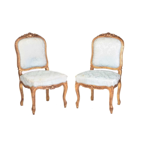 356 - A pair of Louis XV style carved wood and gilt gesso side chairs, 20th century. with cartouch carved ... 