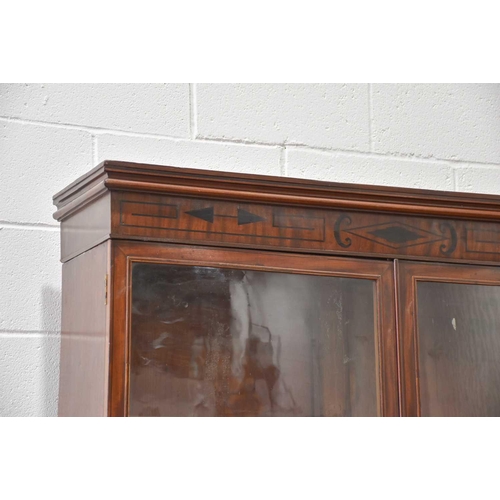 358 - A George IV mahogany cylinder bureau bookcase. the upper section with a pair of plain glazed doors a... 