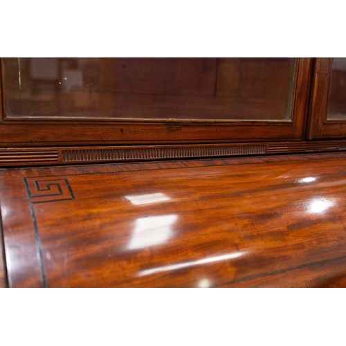 358 - A George IV mahogany cylinder bureau bookcase. the upper section with a pair of plain glazed doors a... 