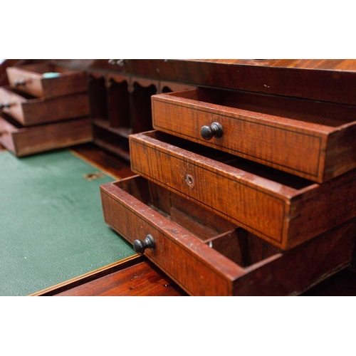 358 - A George IV mahogany cylinder bureau bookcase. the upper section with a pair of plain glazed doors a... 