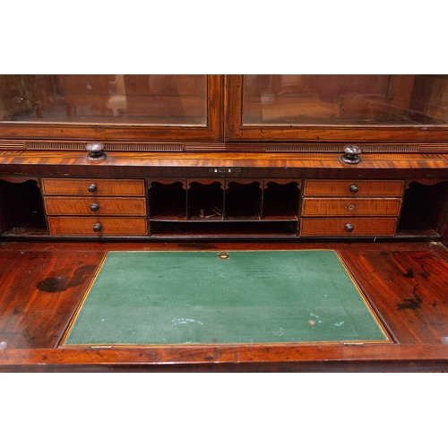 358 - A George IV mahogany cylinder bureau bookcase. the upper section with a pair of plain glazed doors a... 