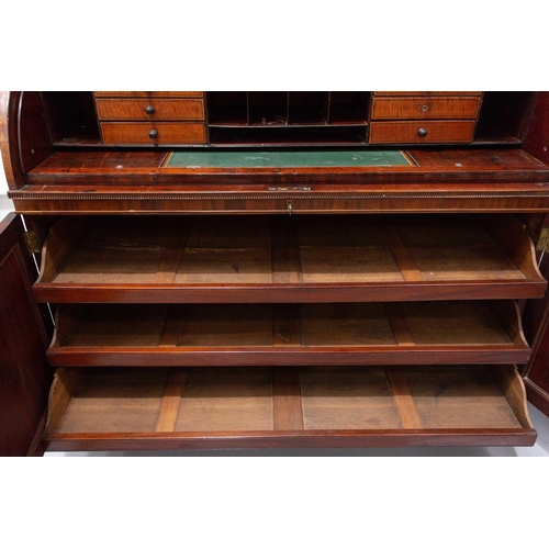 358 - A George IV mahogany cylinder bureau bookcase. the upper section with a pair of plain glazed doors a... 