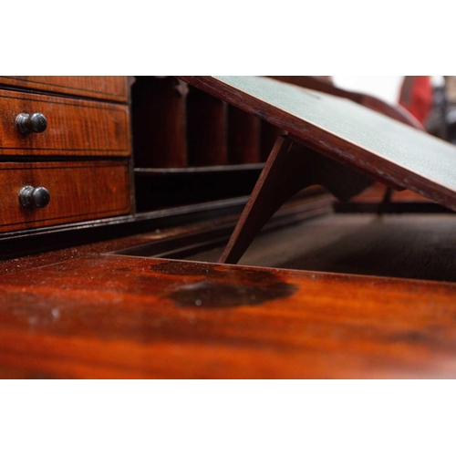 358 - A George IV mahogany cylinder bureau bookcase. the upper section with a pair of plain glazed doors a... 