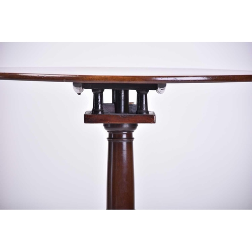 374 - A George III 'Cuban Mahogany' circular tilt-top tripod table, With birdcage movement above bold cabr... 