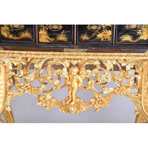 375 - A Queen Anne black lacquer double dome cabinet on a gilt stand. The upper section is decorated throu... 