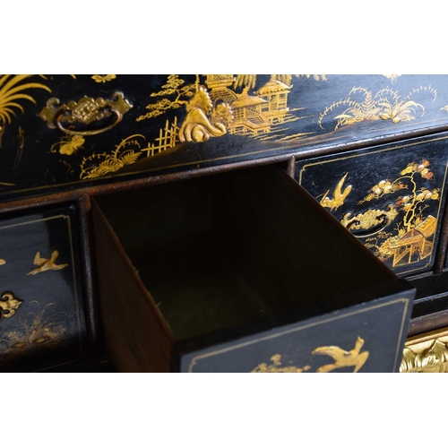 375 - A Queen Anne black lacquer double dome cabinet on a gilt stand. The upper section is decorated throu... 