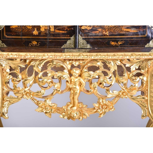 375 - A Queen Anne black lacquer double dome cabinet on a gilt stand. The upper section is decorated throu... 