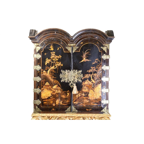 375 - A Queen Anne black lacquer double dome cabinet on a gilt stand. The upper section is decorated throu... 