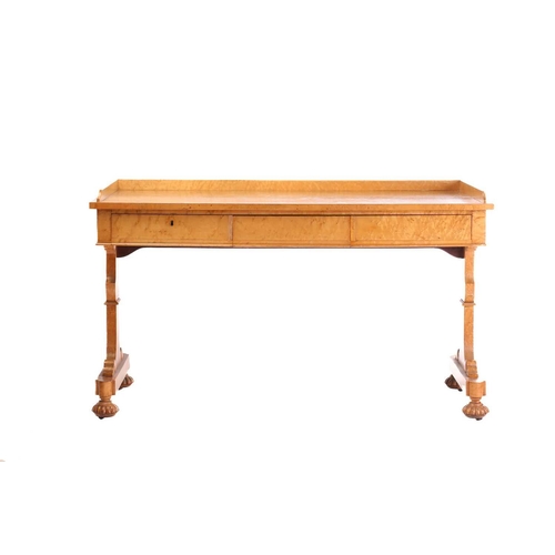 385 - A George IV birds eye maple rectangular writing table by Gillows of Lancaster. With three quarter ga... 