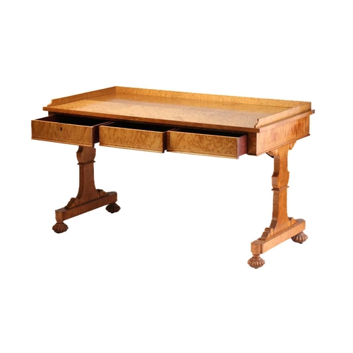 385 - A George IV birds eye maple rectangular writing table by Gillows of Lancaster. With three quarter ga... 