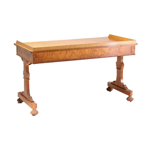 385 - A George IV birds eye maple rectangular writing table by Gillows of Lancaster. With three quarter ga... 