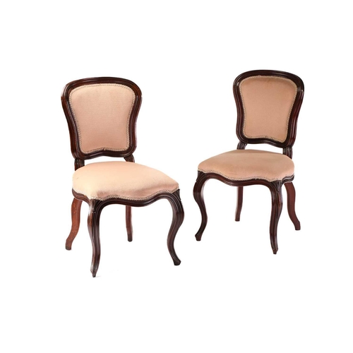 392 - A set of four Louis XV style mahogany cartouch backed side chairs with moulded frames and stuff over... 