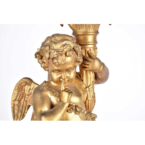 401 - A pair of large French 19th century figural bronze candelabras, in the form of cherubs on a column p... 