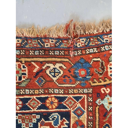 406 - An indigo blue ground Afshar rug, 20th century, with a reciprocating diamond field filled with geome... 