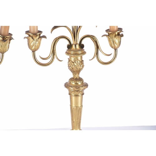 408 - A pair of gilt matel three branch candelabra, late 19th/arly 20th century, the branches terminating ... 