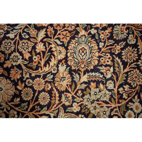 414 - A 20th-century large Persian silk mix Qum style carpet with a central lozenge with scrolling flowers... 