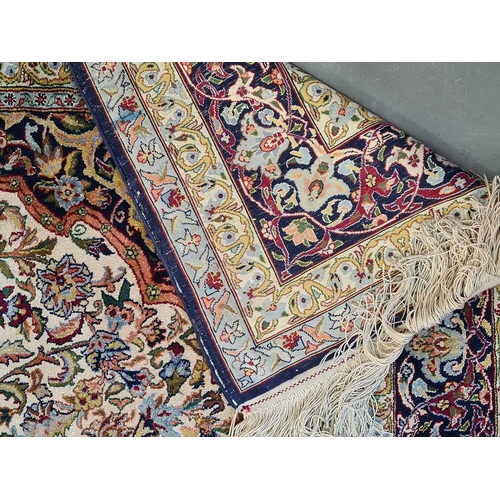 419 - A pair of ivory ground silk on silk Isfahan 