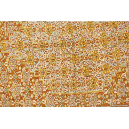 422 - An ochre ground Turkish silk Kelim rug with a large central lozenge filled with geometric designs wi... 