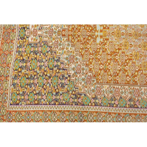 422 - An ochre ground Turkish silk Kelim rug with a large central lozenge filled with geometric designs wi... 