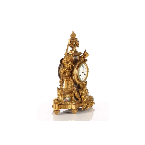 425 - A late 19th century Samuel Marti et Cie 8-day ormolu mantle clock with flaming urn finial and inset ... 