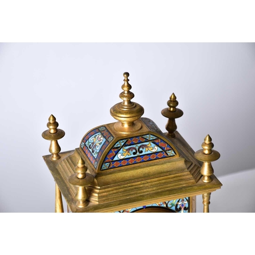 431 - A French gilt metal and champleve enamel mantel clock, 19th century, with turned finials and columns... 