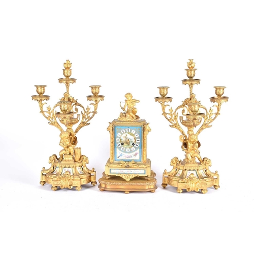 435 - A matched gilt metal clock garniture, 19th century, each with Paris porcelain panels, the clock with... 