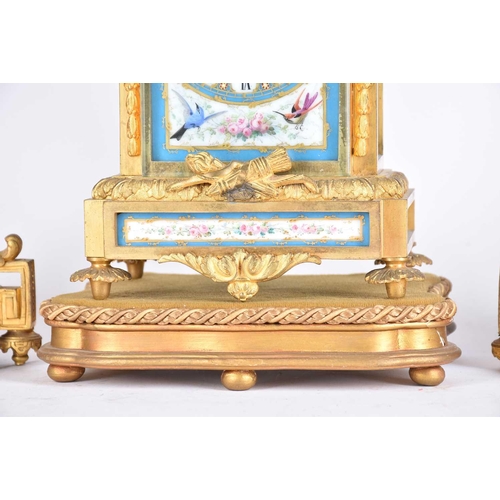 435 - A matched gilt metal clock garniture, 19th century, each with Paris porcelain panels, the clock with... 