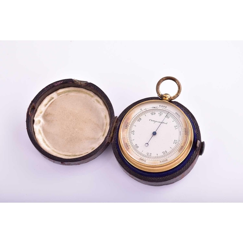 436 - A brass compensated pocket barometer and compass ; silvered circular dial; in original leather-bound... 