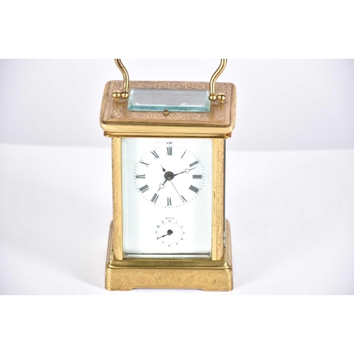 445 - A large brass cased carriage clock, late 19th century, the enamel dial with roman numerals and subsi... 