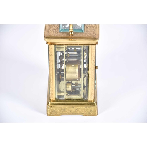 445 - A large brass cased carriage clock, late 19th century, the enamel dial with roman numerals and subsi... 