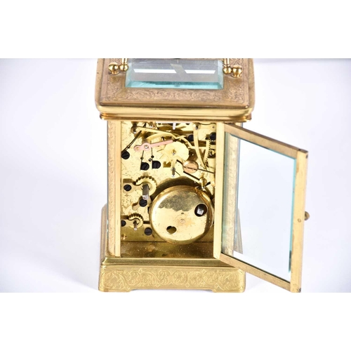 445 - A large brass cased carriage clock, late 19th century, the enamel dial with roman numerals and subsi... 