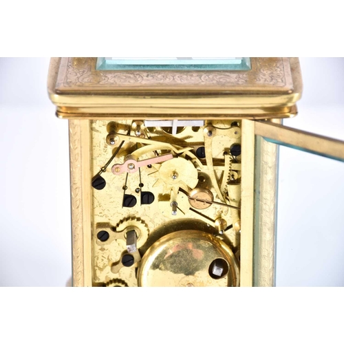 445 - A large brass cased carriage clock, late 19th century, the enamel dial with roman numerals and subsi... 