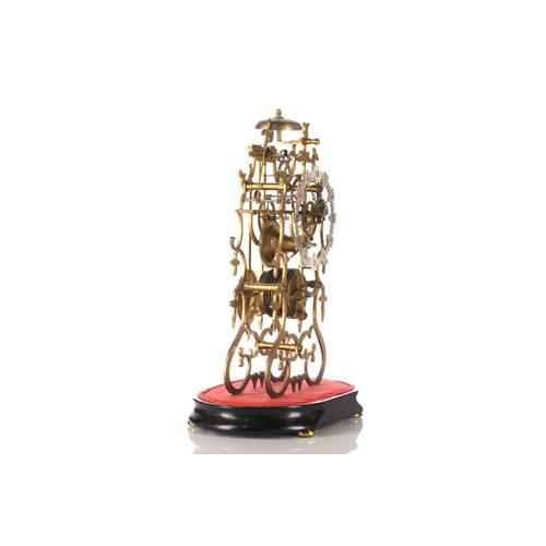 447 - A 20th-century single fusee skeleton clock with a barbed outline fitted a shaped and silvered chapte... 