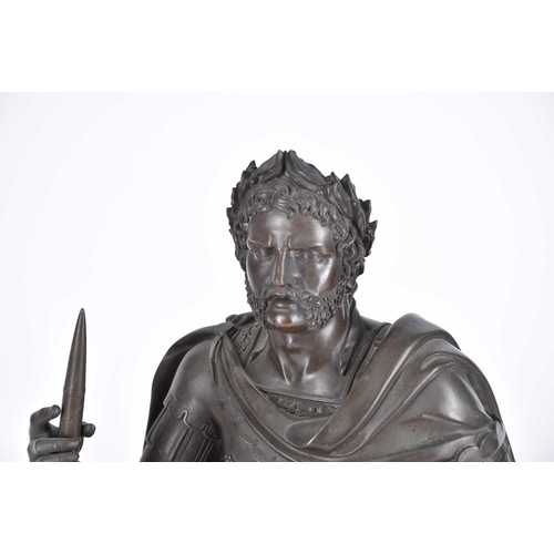 458 - A 19th century French bronze, modelled as a seated Roman Emperor, holding a scroll and resting his a... 