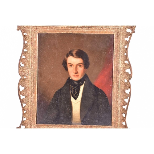 46 - Attributed to Stephen Pearce (1819-1904), a portrait of a gentleman in a black frock coat, oil on pa... 