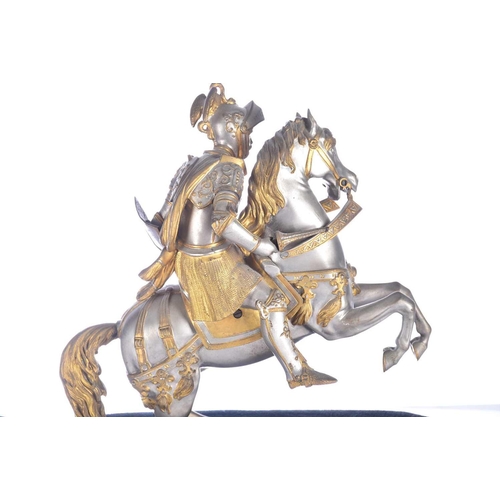 471 - A pair of parcel gilt and silvered metal equestrian warrior figures, 20th century, modelled as a med... 