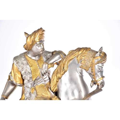 471 - A pair of parcel gilt and silvered metal equestrian warrior figures, 20th century, modelled as a med... 